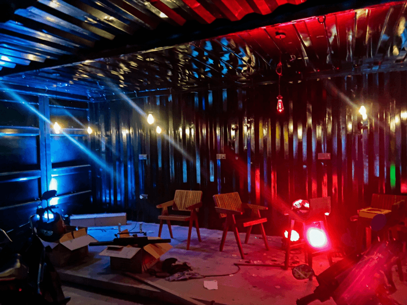 Container interior with vivid red and blue par light washes